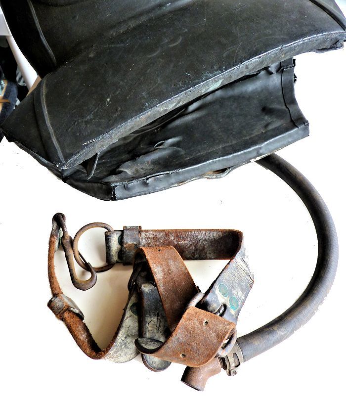The leather belt attaches to the helmet image