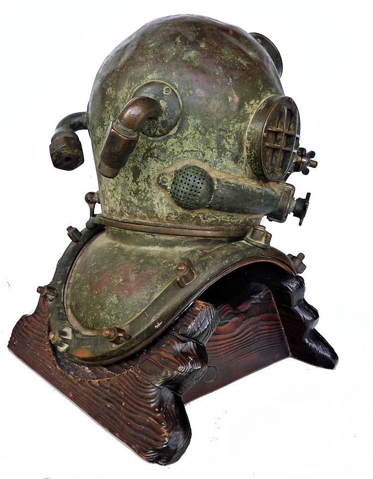 Partial side view of back of 1942 Schrader Navy MK V dive helmet image> <p> </p> </td> </tr> </tbody> </table> <table align=